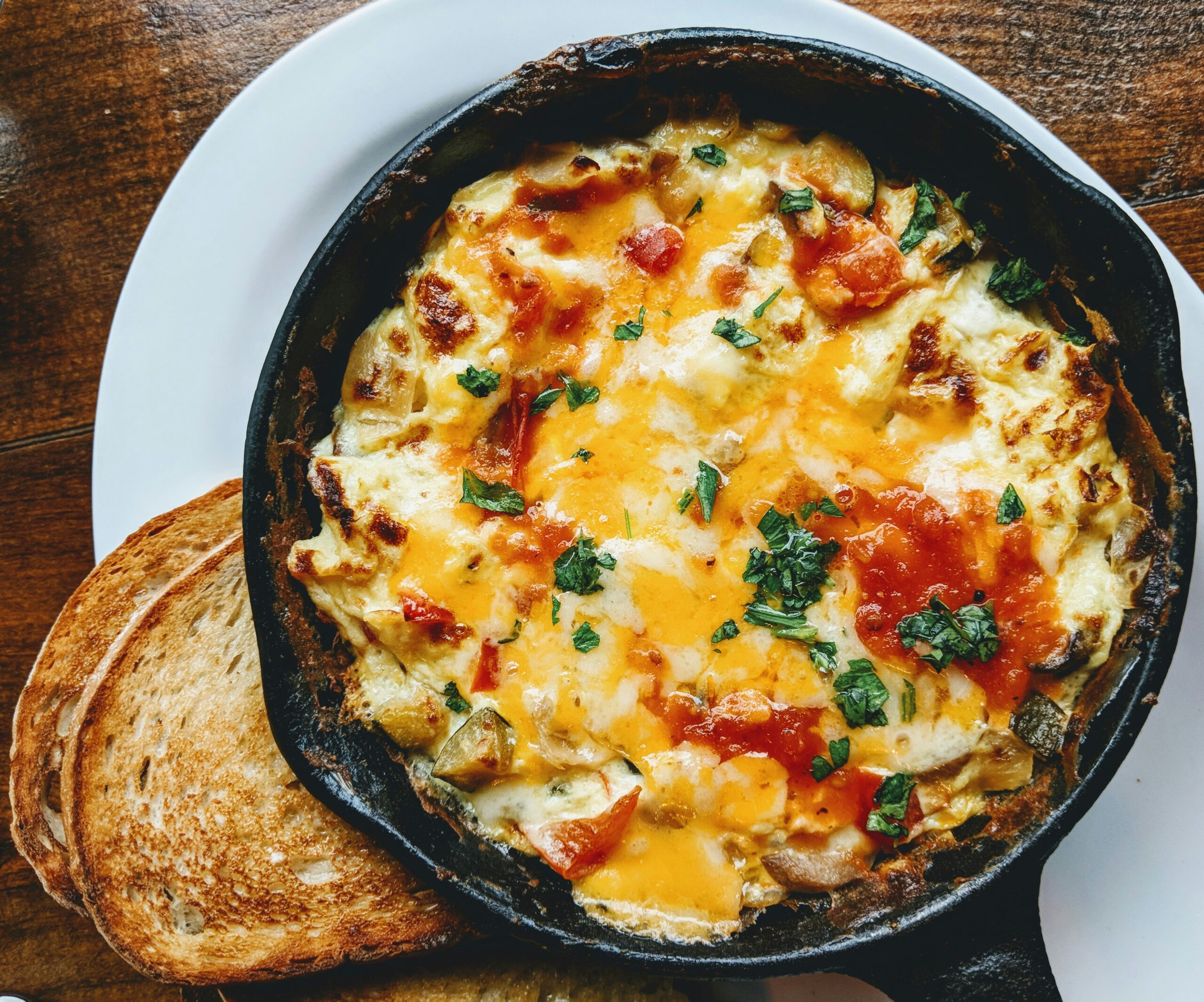 Top 10 breakfast casserole recipes served in baking dishes with eggs, cheese, potatoes, and breakfast ingredients.